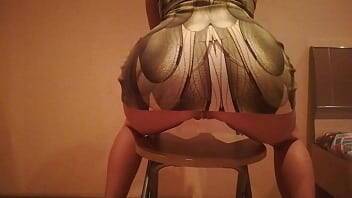 Erotic dance on a chair in a dress made of snake skin on youpornvideos.one