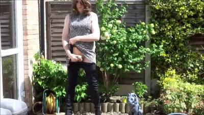 Sexy masturbating crossdresser in thigh boots outdoors on youpornvideos.one