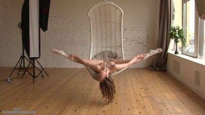 Flexible Beauty Ballerina Playfully Poses For Me In A Hanging Chair, Moving Her Long Legs Wide. 4 Of 6 on youpornvideos.one