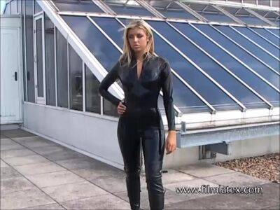 Blonde latex-babes outdoor knee boots and high heels of fetish girl in tight full body rubber outfit with softcore glamour model Karina outside on the roof on youpornvideos.one