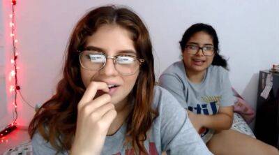 Two nerdy latinas playing with their pussies on cam on youpornvideos.one