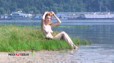 Playful blond nudist teen caught on camera naked at the beach on youpornvideos.one