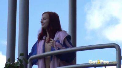 Watch this kinky redhead get a public surprise while peeing in the city on youpornvideos.one