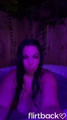 Brunnette flashing her boobs at the hot tub on youpornvideos.one