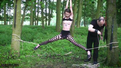 Submissive teen tied up in the woods on youpornvideos.one