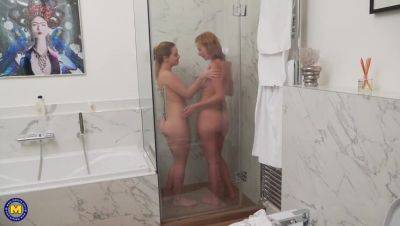 Mature star Effie Gold enjoys a steamy lesbian shower with Karry on youpornvideos.one